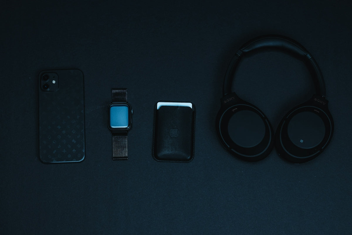 black and blue iphone case on black surface